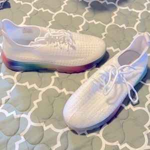 White rainbow soled shoes